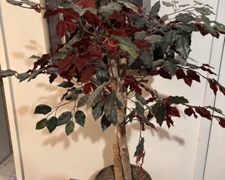 Artificial plant 4’ tall 11” diameter basket base.     $ 40.00