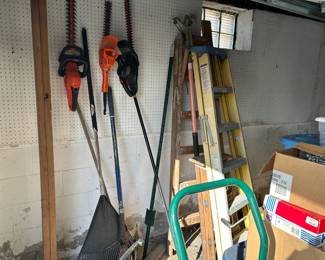 garage items, trimmers, rake, ladders