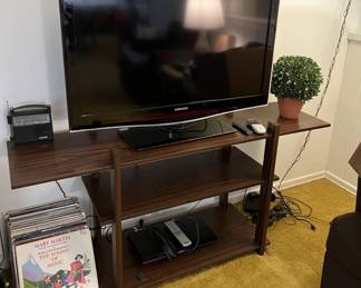 As is often the case, there is a television for sale, along with the entertainment shelving unit, and a few LPs.