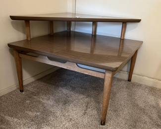This corner side table certainly evokes a certain look.