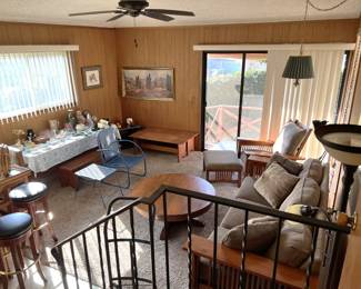 This is an overview of the room with its contents: barstools, benches, chairs, and more.