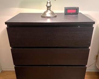 This dresser has a very dark look.  As does the classic green-glass lamp.