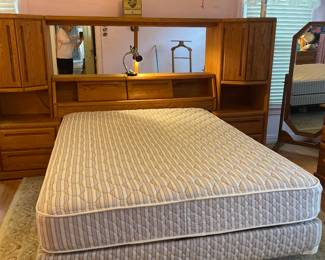 Mirrored Queen Headboard Unit.  4 drawers; 2 cabinets; Privacy sliding doors. 