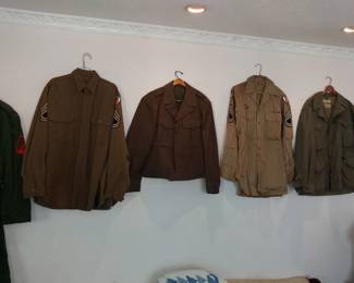 Military uniform items.  Rain coat, Wool Blouse with Insignia, Short wool coat, Shirt with Rank, Military Jacket. Other GI items available.  WW2 Vet.