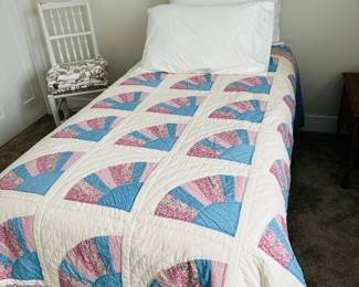 Twin bed; hand-crafted quilt