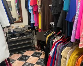 Ladies closet of designer clothing 