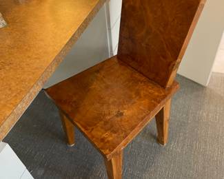 One of two wood slab chairs