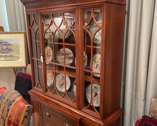 Federal mahogany break front cabinet with oriental collector plates