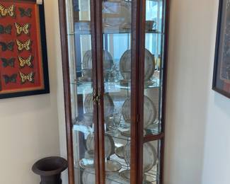 Mahogany Pulaski curio cabinet with iron urns