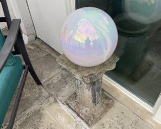 Old concrete gazing ball stand 