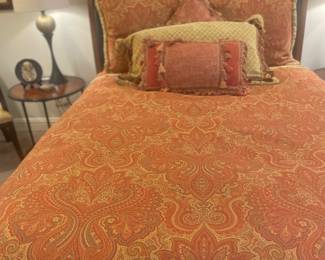Wonderful leather head and footboard Queen size bed and custom bedding 