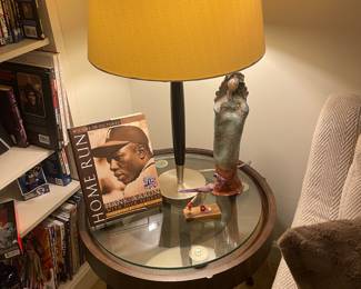 Glass top mahogany contemporary end table ( one of a pair with autographed Hank Aaron book and art pottery figurine