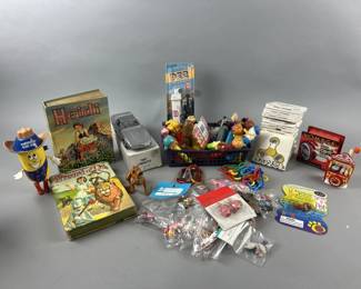 Lot 210 | ‘57 Wizard Of Oz Book, Pez, Fidget Spinners & More

