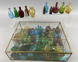 Lot 486 | Miniature Decanters With Glass Case & More
