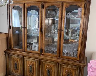Large 4 door China hutch with glass shelves and lower storage