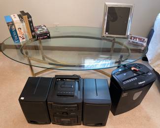 Oval glass top metal based coffee table