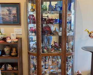 Lighted, mirrored curio- there are 3 of these curios for sale.
Contents for sale as well.