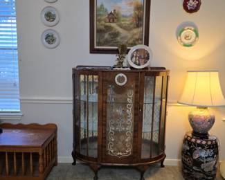 Unique MCM curio with built-in clock, mirrored back and glass shelves