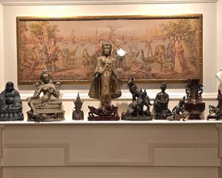 Large selection of statues, figurines and vases from a variety of cultures. NOTICE:  The framed tapestry above the mantel