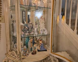 a beautiful, ornate,, lighted curio with drawer that's full of beautiful collectibles