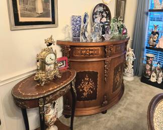 we have a pair of these little side/lamp tables with brass accents.  The half-barrel chest is actually a glass-topped bar