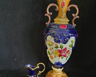 The little blue vase is marked Porcelaine d'Art LIMOGES - France Imperial.  The tall one is hallmarked Made in Austria