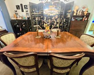 Antique dining table with 6 upholstered chairs, and a room full of furnishings and collectibles
