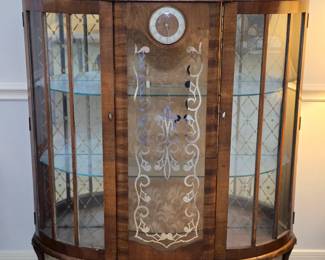Unique MCM curio with built-in clock, mirrored back and glass shelves
