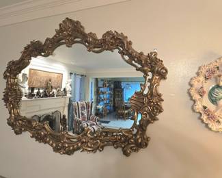 ornate mirror, and vintage wall plaques