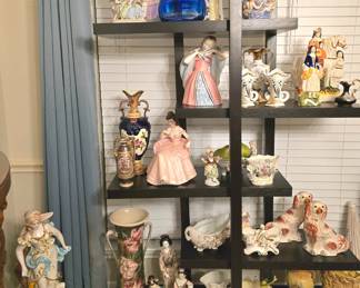 lots of collectible figurines and vases in all sizes  ... the display shelves are also for sale