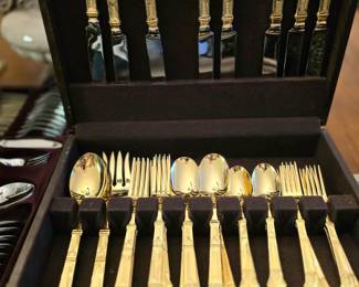Gold tone silverware set