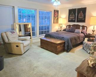 here you can see the vintage cedar chest, leather recliner, and floral bedroom chair along with the bedroom suite.