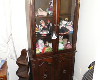 Madame Alexander dolls in cabinet