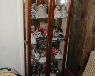 Curio cabinet filled with Madame Alexander Dolls