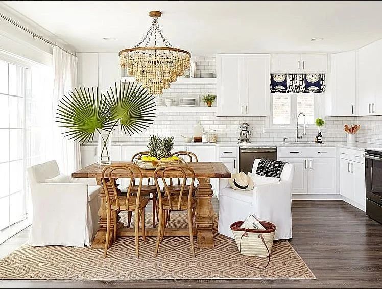 Beautifully updated L-shaped kitchen with crisp white cabinetry; GE appliance suite