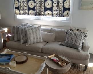 Stylish couch by Lee Enterprises; fabulous accent table window treatments 