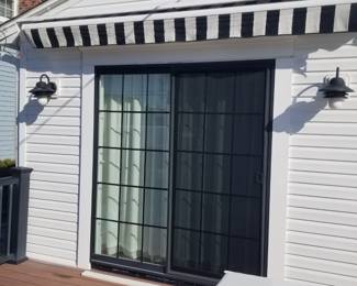 Sliding glass doors; manual awning is approx. 11 ft. wide 