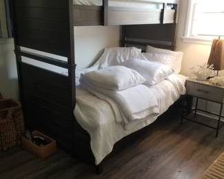 Twin over queen bunk bed with a twin trundle below!