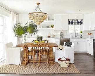 Beautifully updated L-shaped kitchen with crisp white cabinetry; GE appliance suite