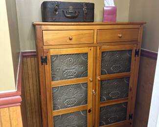 Vintage Ethan Allen pie safe with two drawers over six punched tin panels