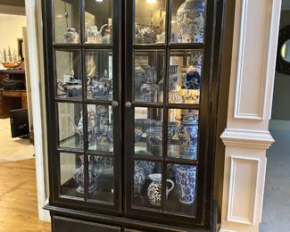 Black illuminated display cabinet with two drawers
