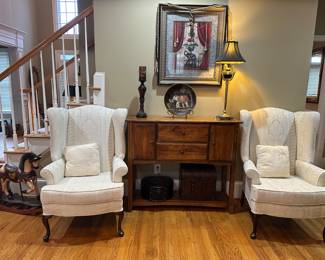 Custom upholstered Queen Anne style wing chairs