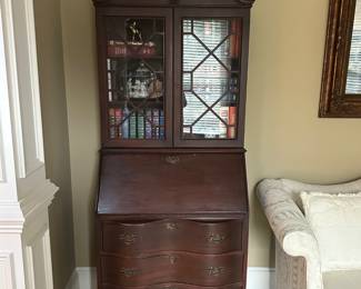 Vintage secretary bookcase with slant front, serpentine case on claw and ball feet