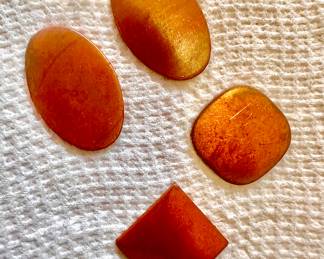 Numerous flat copper arts and craft pieces