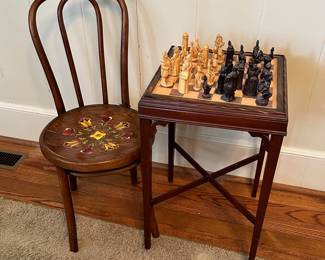 Bentwood chair with hand painted floral design.  Game table with wooden chess pieces.