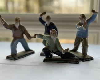 Clay ceramic figurines performing Tai Chi.