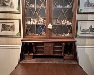 Antique colonial secretary with lid opened.