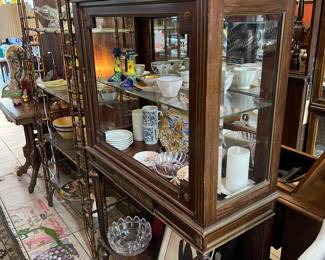 English bone china, collectible kitchenware and tea cup sets inside of this lovely display cabinet -- ALL IS FOR SALE! (BEHIND AND TO THE RIGHT IS A LOVELY GOLD IRON RATTAN VINTAGE "HOLLYWOOD REGENCY" ETAGERE! FABULOUS!)