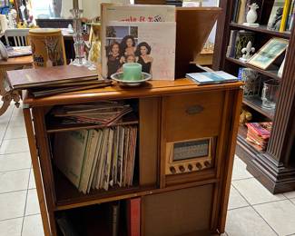 VITAGE RECORD PLAYER IN CABINET... IT WORKS! THE RECORD ALBUMS INSIDE WERE ORIGINAL WHEN WE OICKED IT UP FROM A 1950'S "TIME-CAPSULE HOUSE IN THOUSAND OAKS!