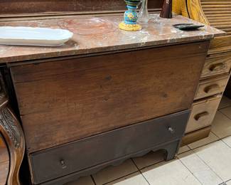 This is a commode that came from a nice family's home locally in Thousand Oaks. They had some very well-kept antiques in almost every room in their house. This is just one of a few pieces we are selling for them. The top is a beautiful salmon colored marble w/ backsplash.